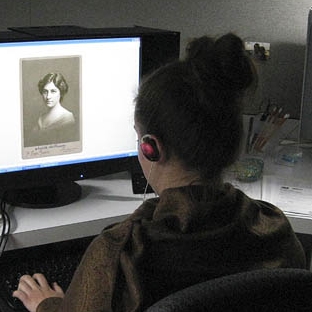 Woman editing a digital image of a 19th-century photograph
