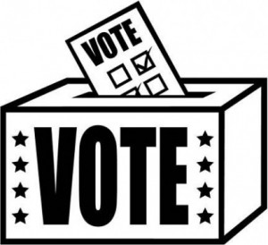 clip art of a ballot dropping into a box that says "VOTE"