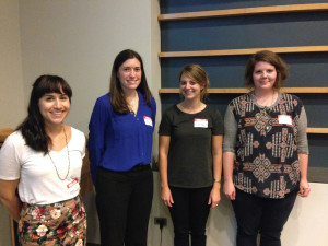Four smiling conservators posing in a line.