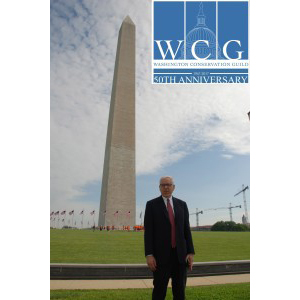 David Rubenstein poses in front of the Washington Monument