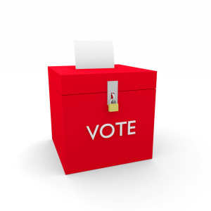 Animated image of a red, locked ballot box with a blank ballot sticking out of the top.