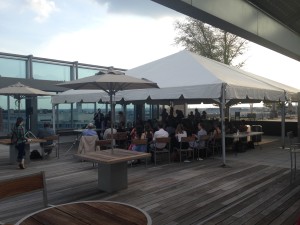 Large white tent on a rooftop patio