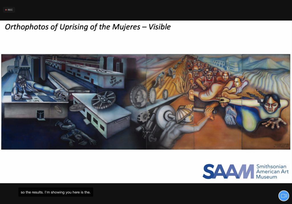 Screenshot of a virtual presentation. Colorful horizontal mural fills slide.