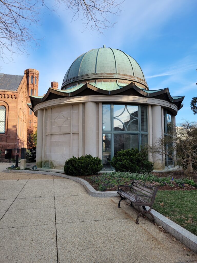 Entrance to the Ripley Center with the Smithsonian Castle in the background.