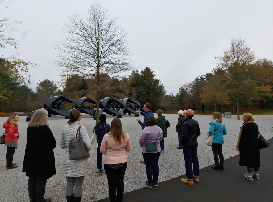 Group being shown an outdoor sculpture at Glenstone Museum.