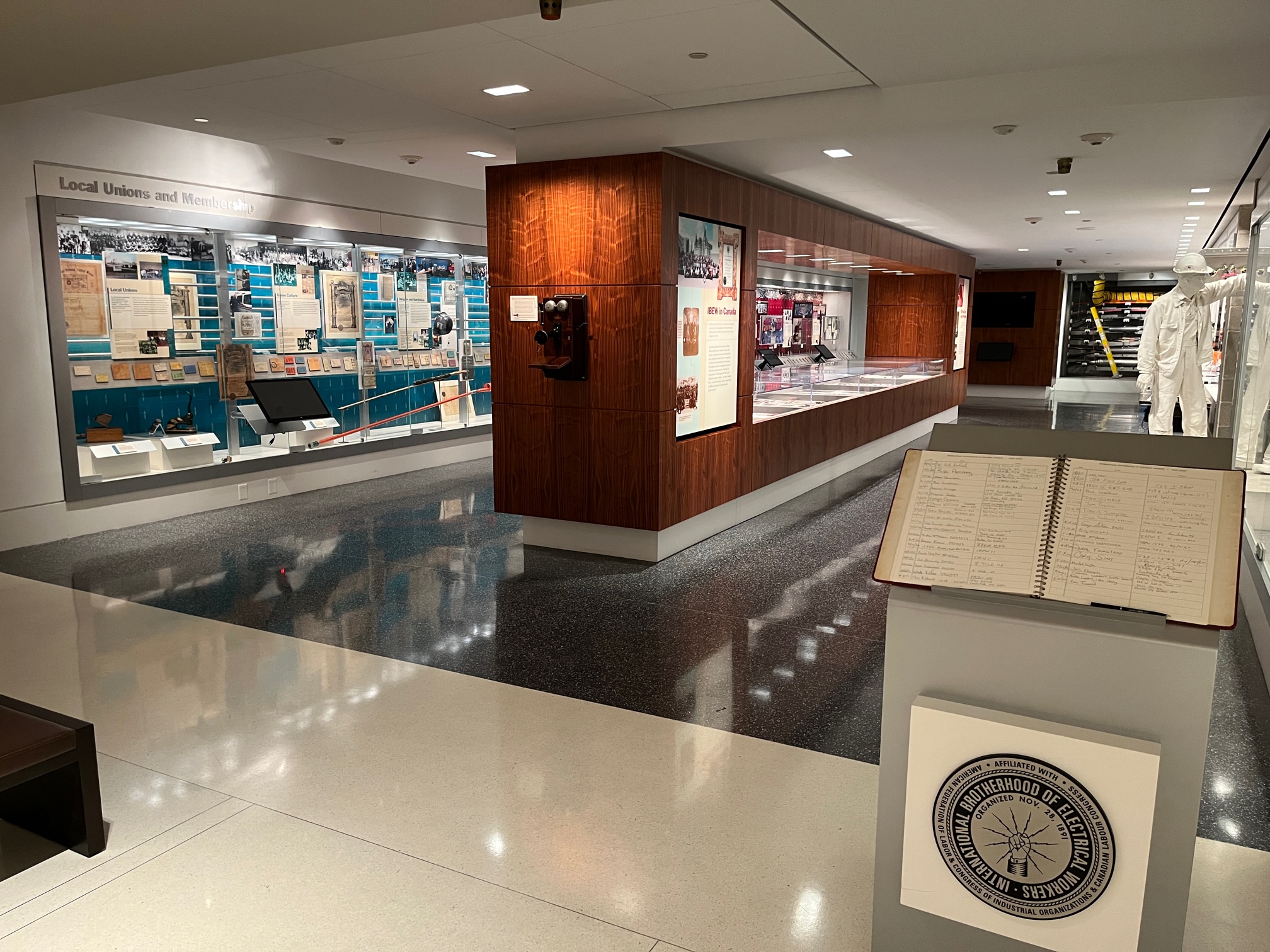 View of museum gallery with cases of objects.